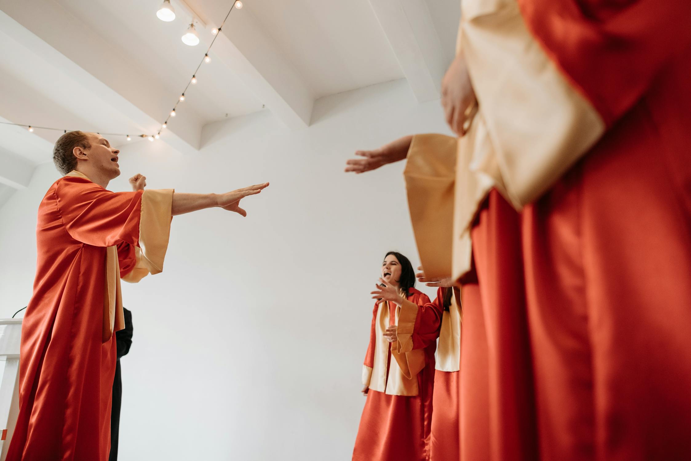 a group of people in red gowns