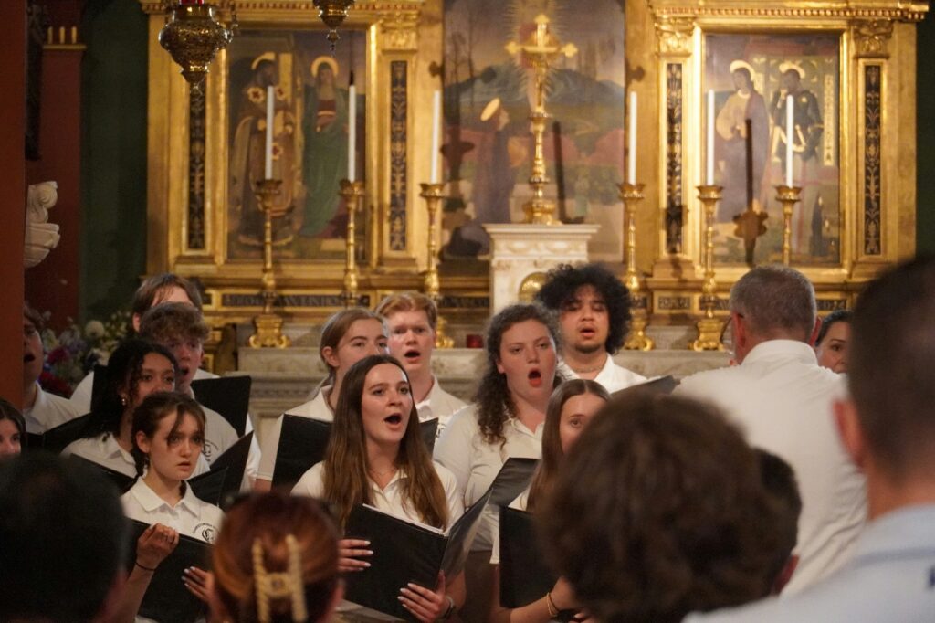 Christians singing gospel songs with instrumental track in the background